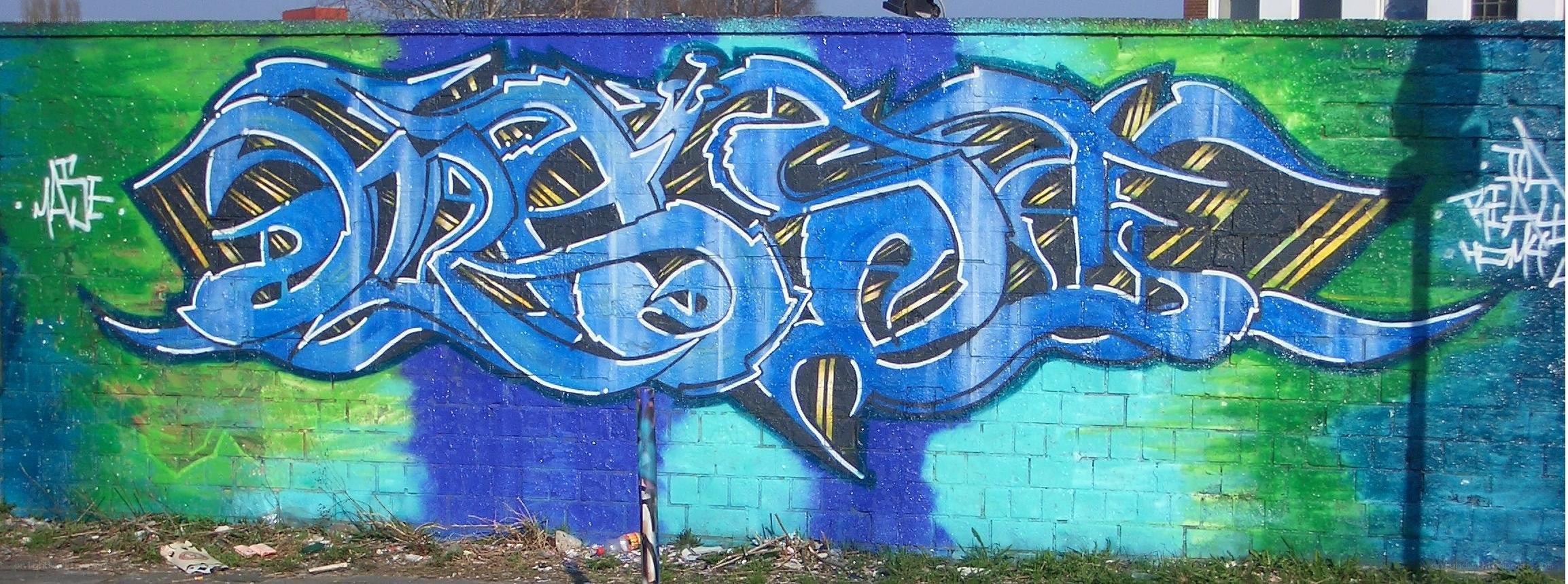 blue graffiti on a wall