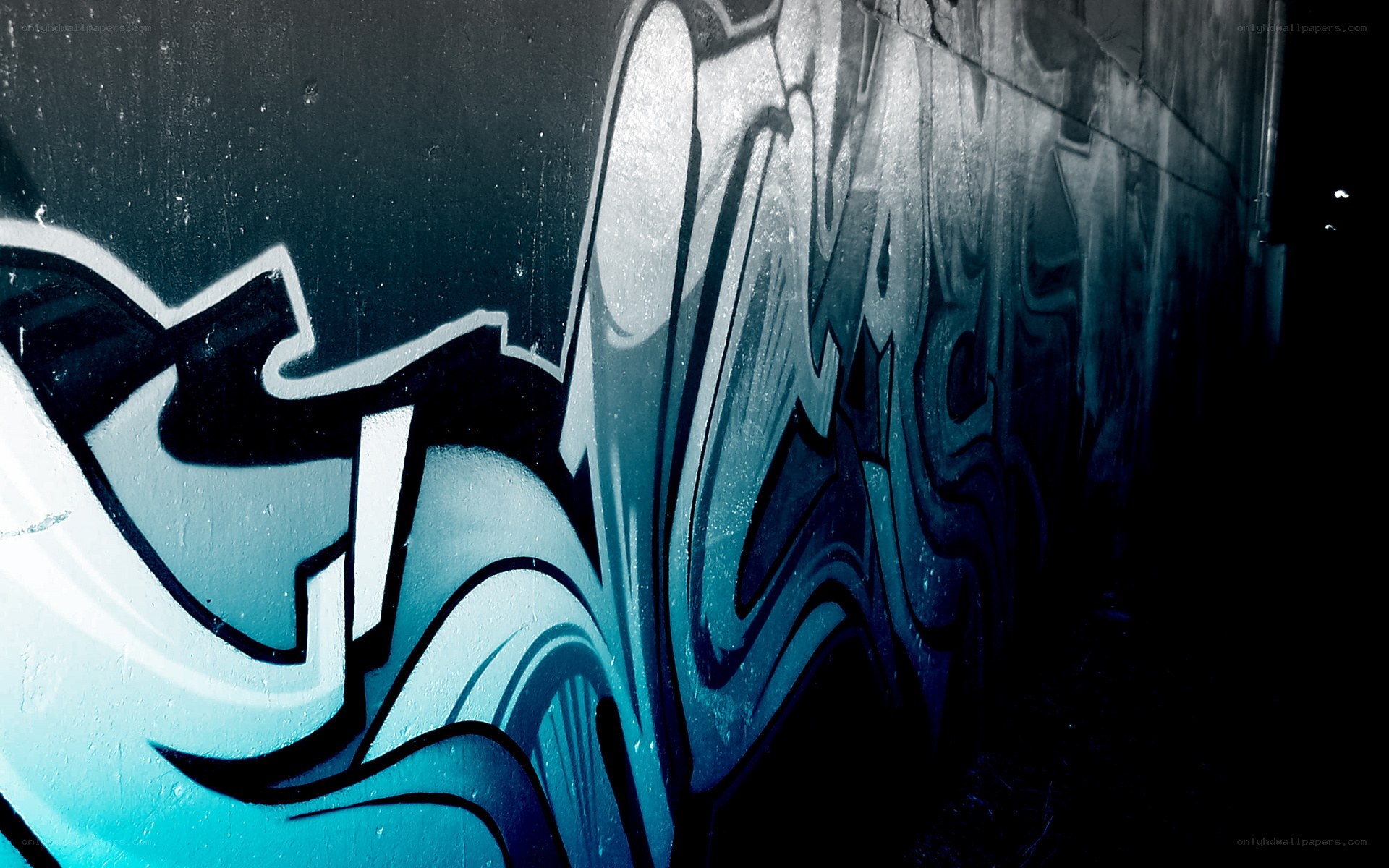 blue graffiti on a wall