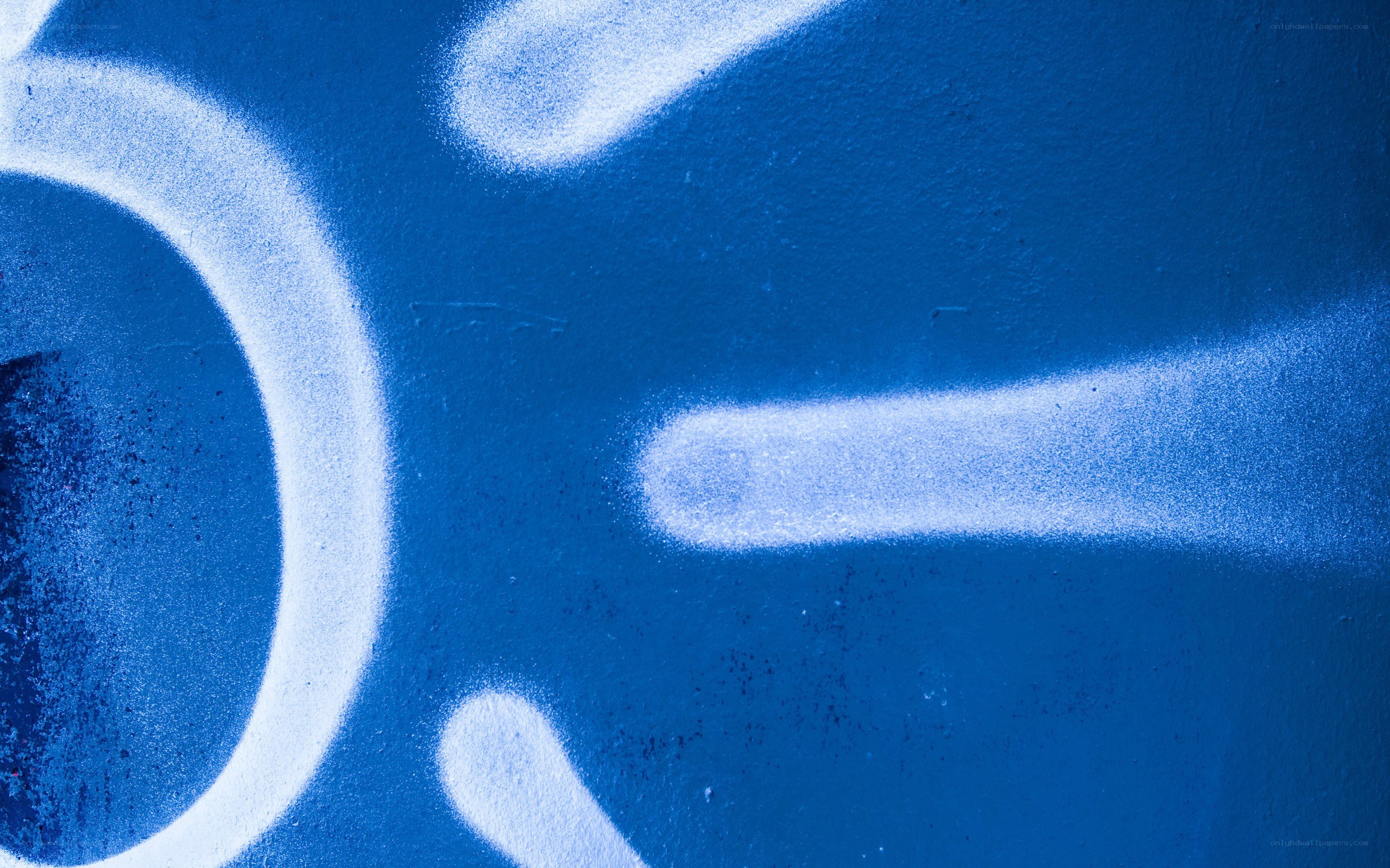 blue graffiti on wall