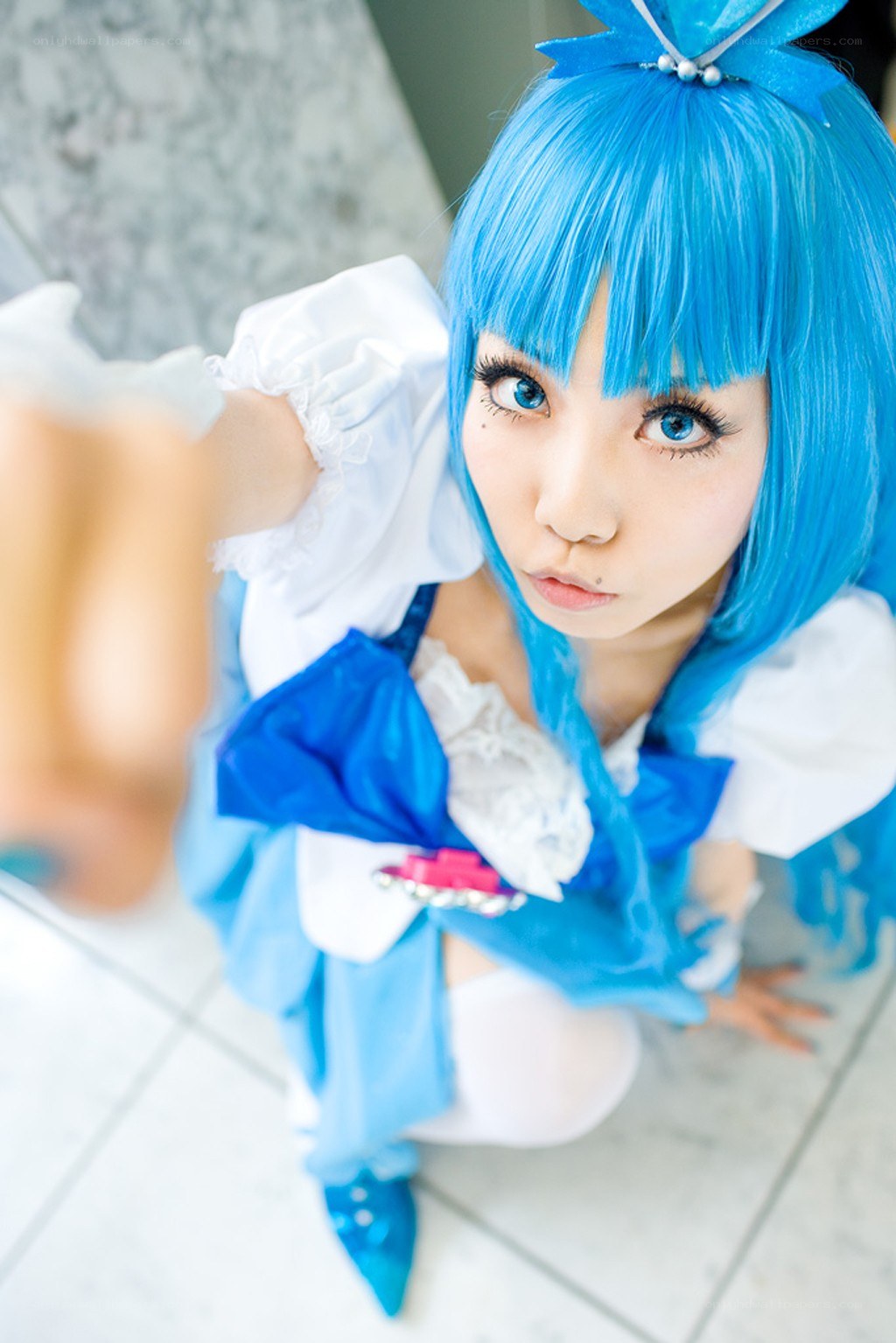 blue-haired cosplayer in costume