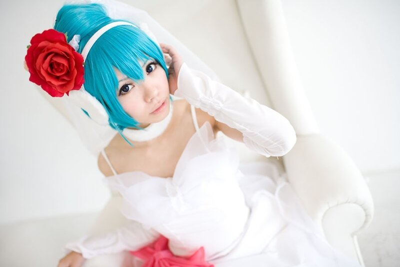 blue-haired cosplayer in white dress
