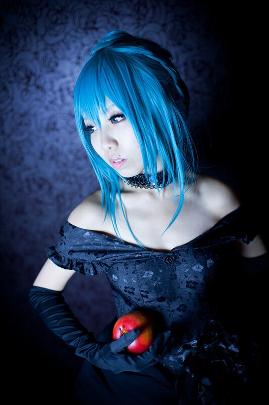 blue-haired cosplayer with apple