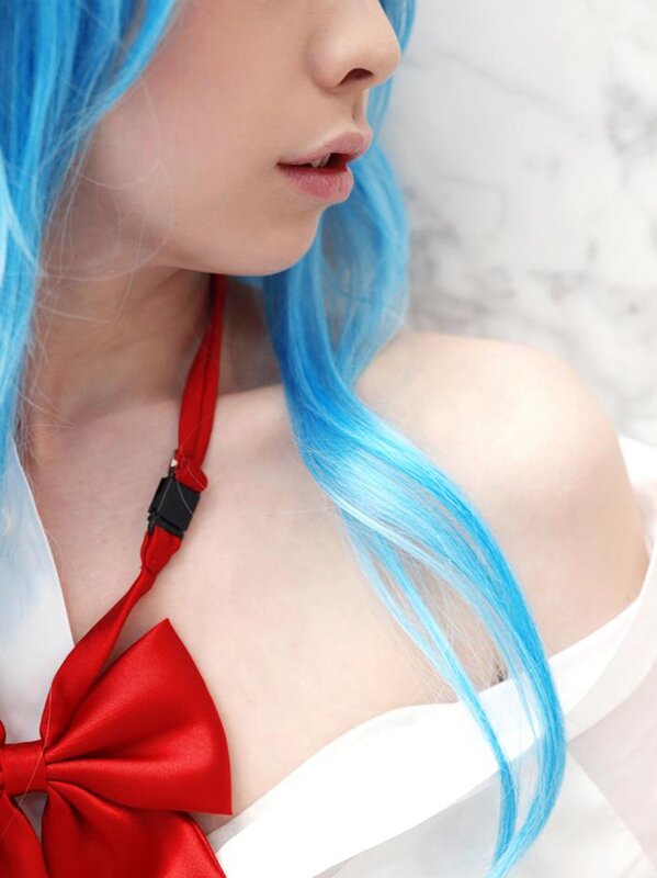 blue-haired cosplayer with red bow