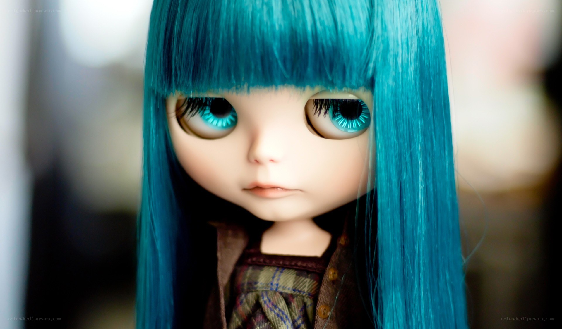 blue-haired doll with large eyes