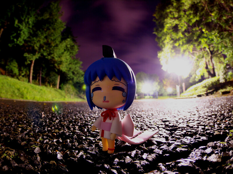 Blue-haired Figurine on Road