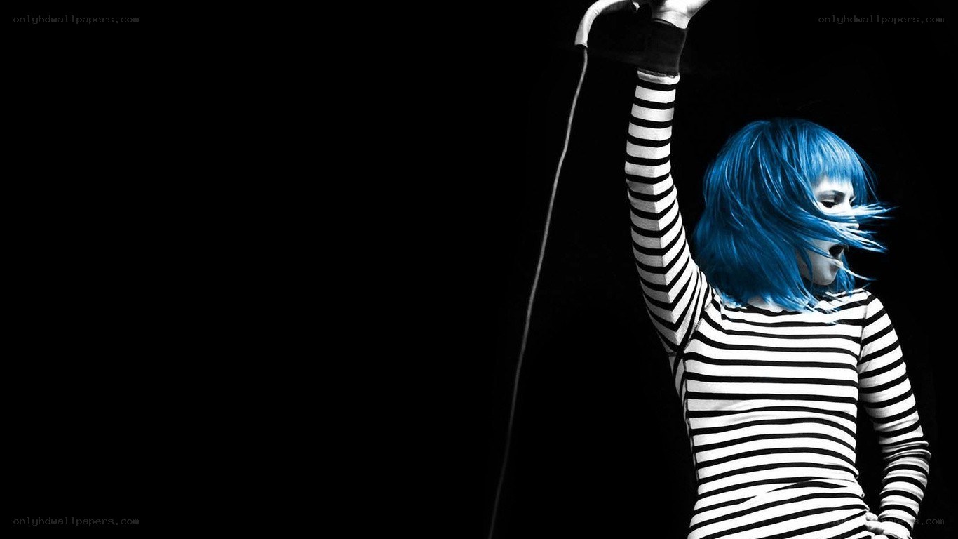 blue-haired performer on stage