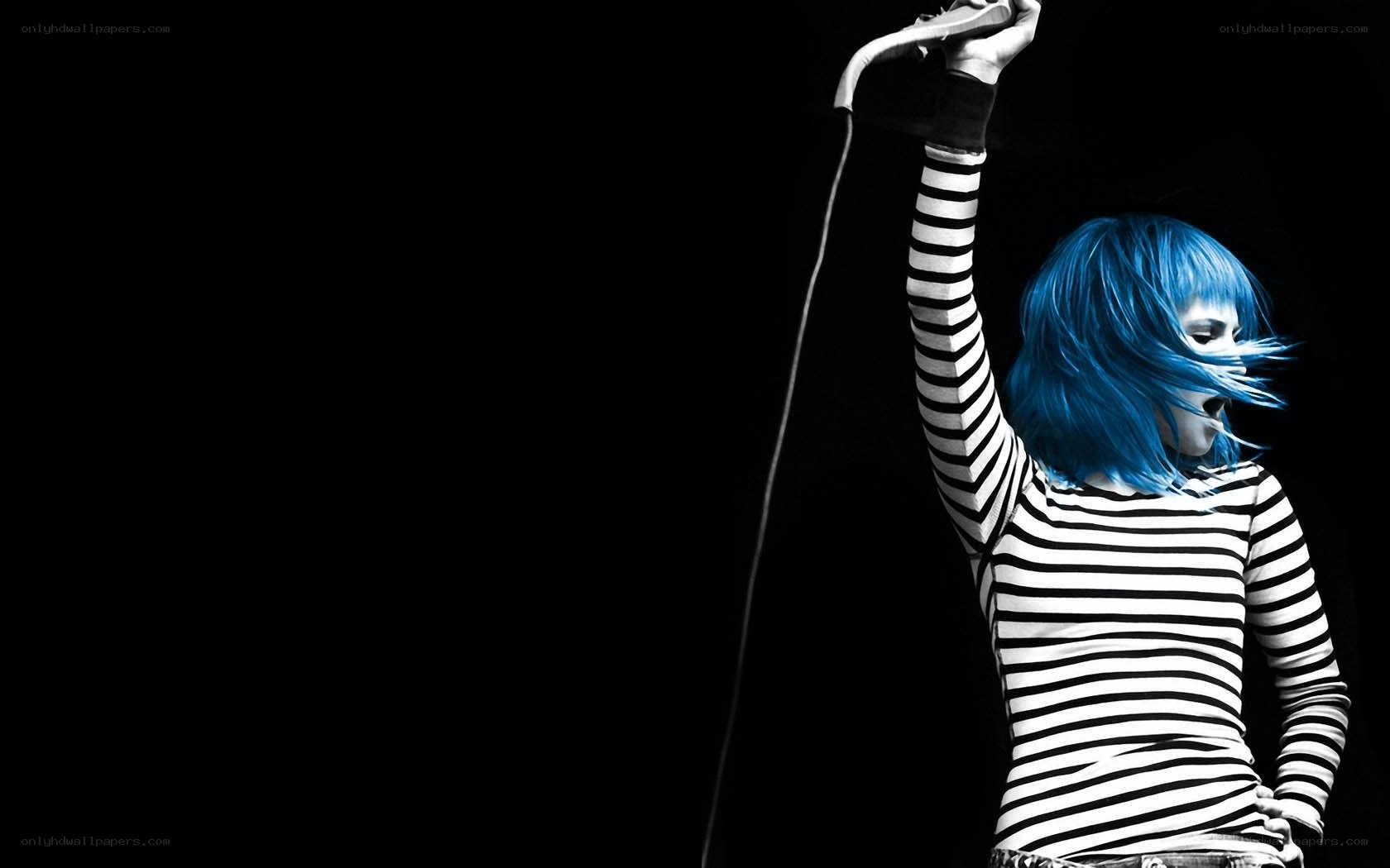 blue-haired performer on stage