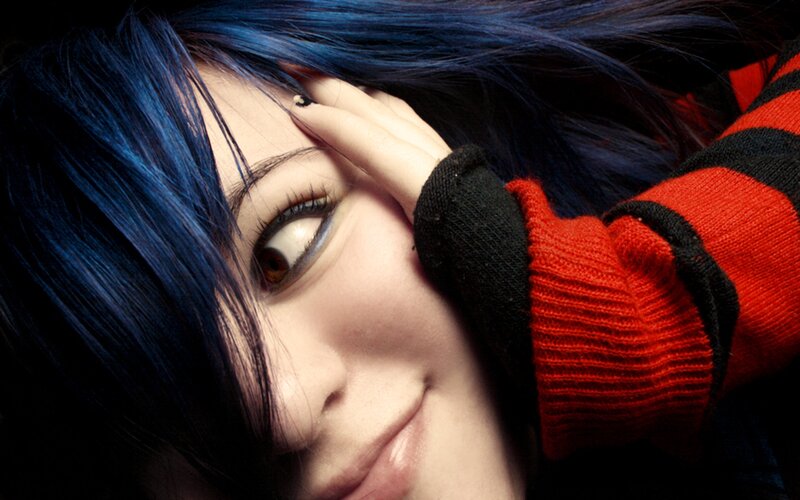 blue-haired person in red sweater