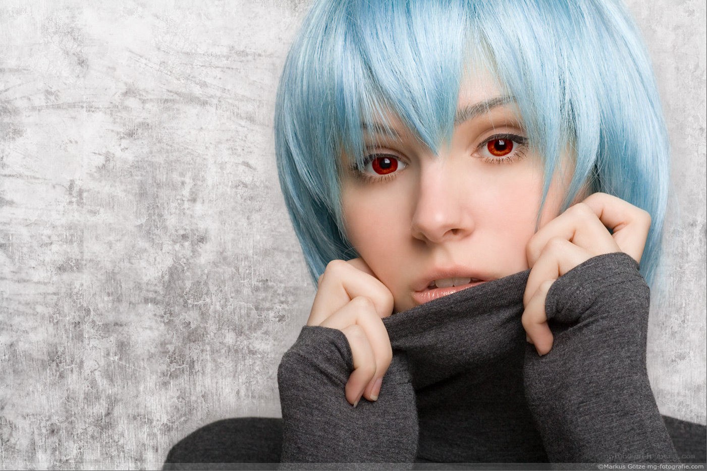 blue-haired person with red eyes