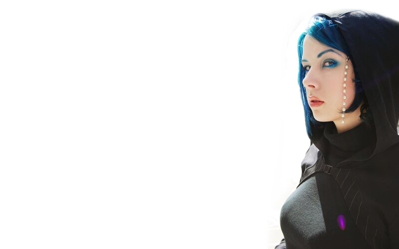 blue-haired woman in black hood