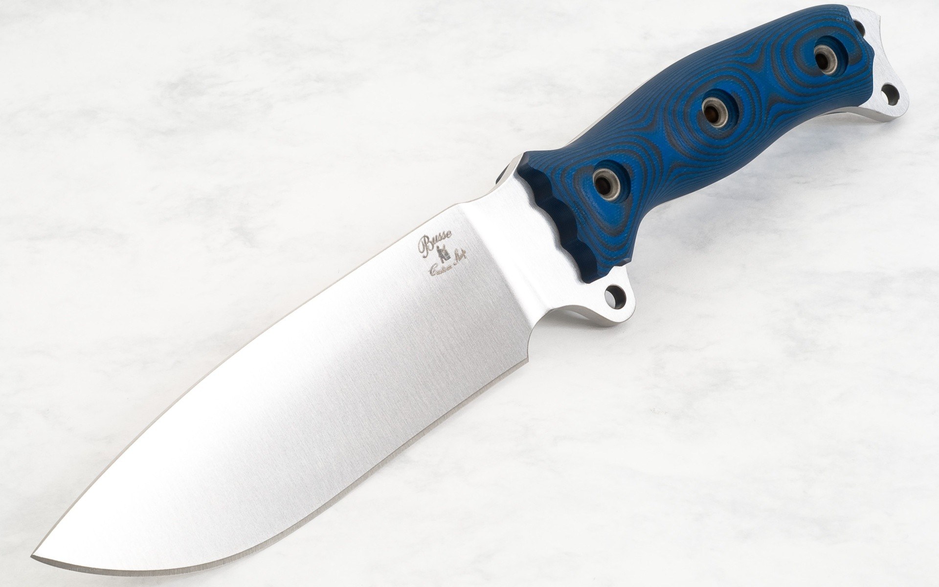 blue-handled knife on marble