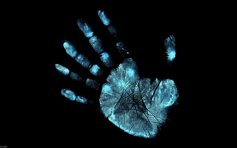 Blue Handprint on Black — Dramatic