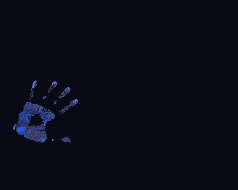 blue handprint on black