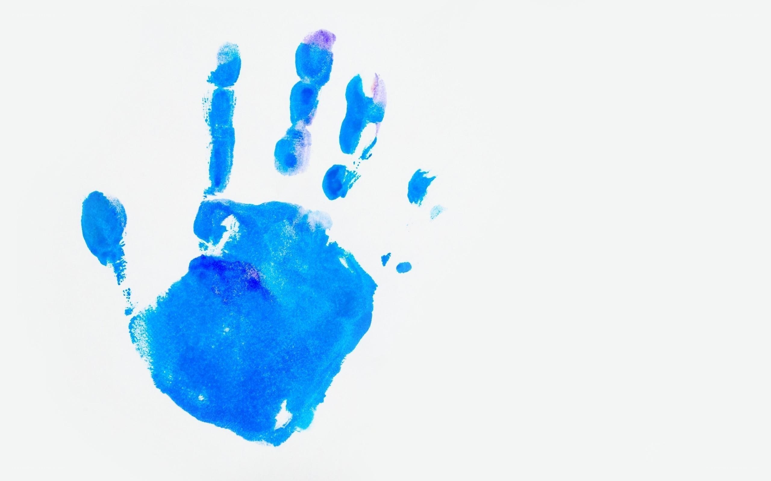 blue handprint on white paper