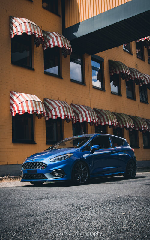 Blue Hatchback Car — Dramatic, Afternoon, Photograph