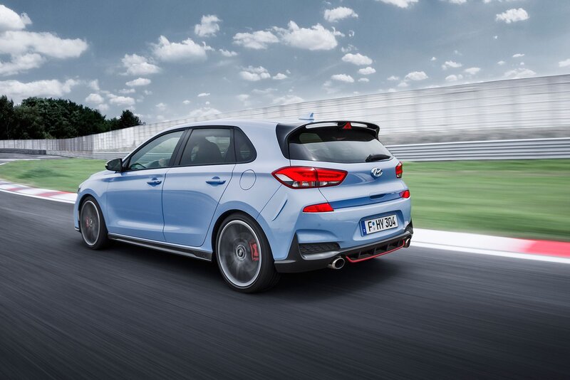 Blue Hatchback Car — Dynamic, Afternoon, Photograph