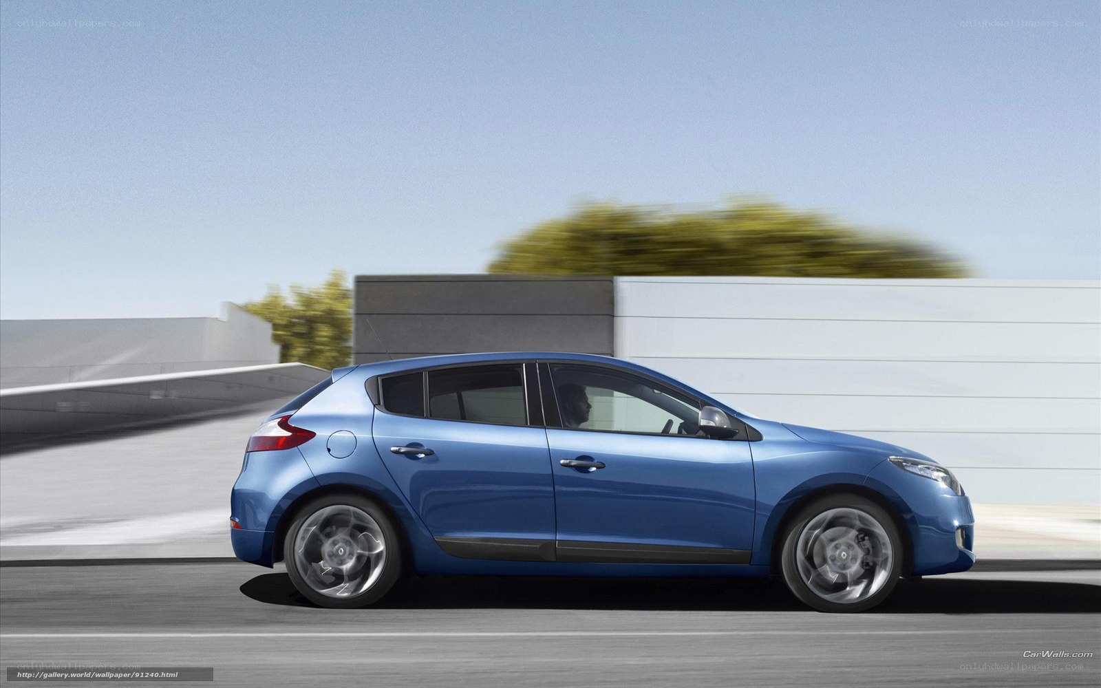 blue hatchback car in motion