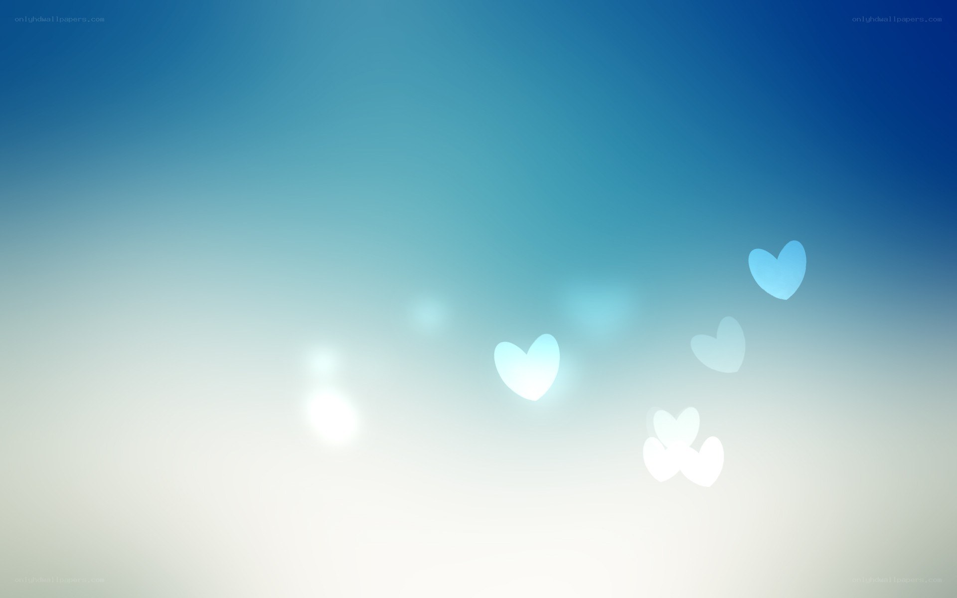 blue hearts floating in light