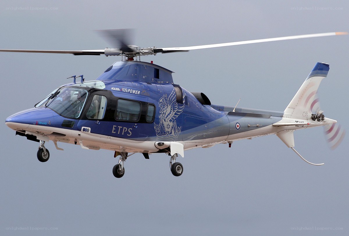 blue helicopter in flight