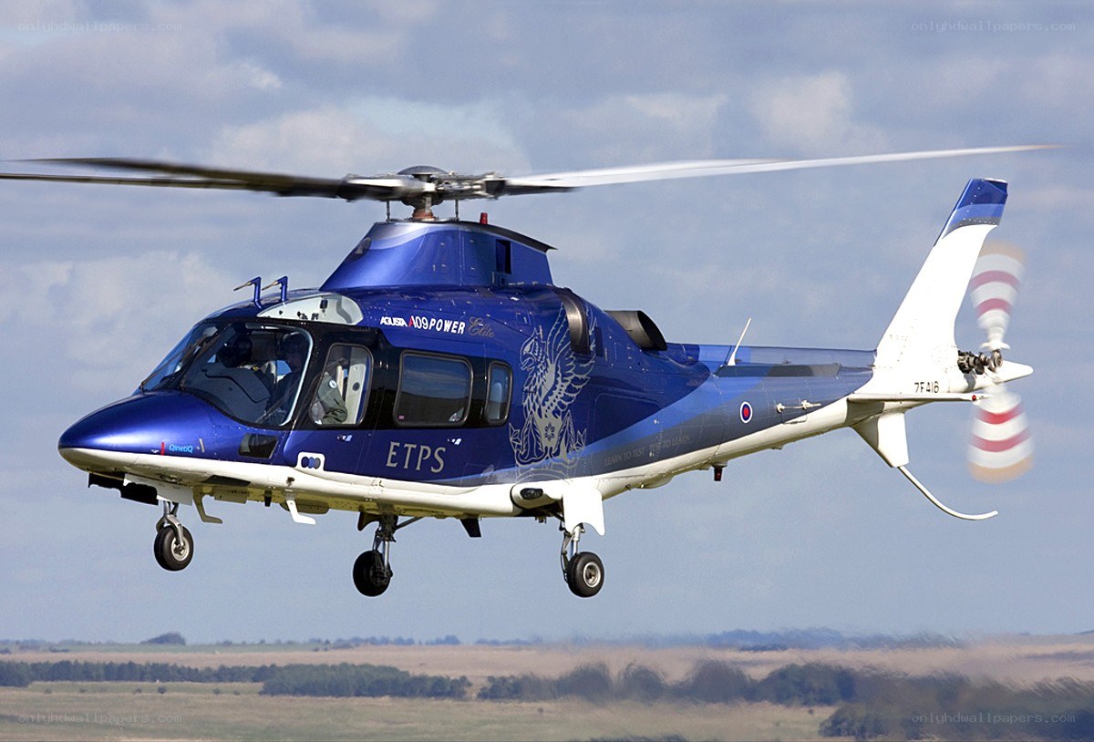 Blue helicopter in flight