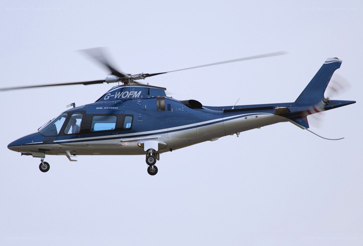 Blue helicopter in flight