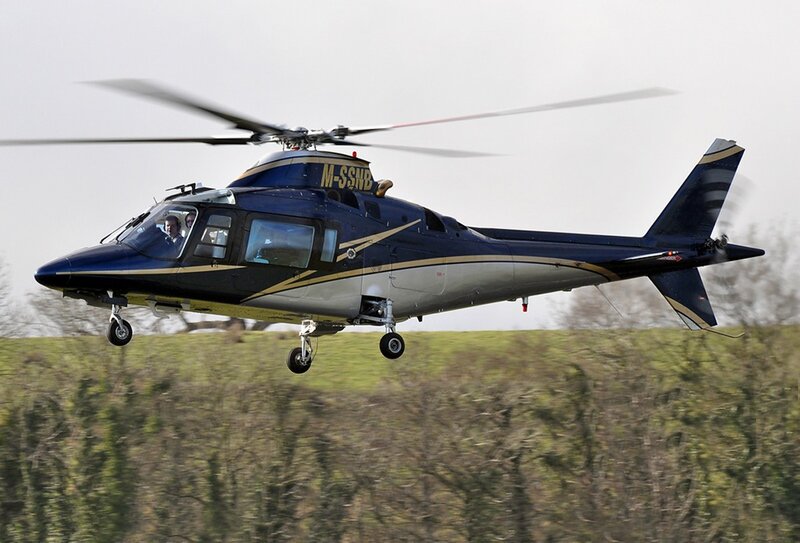 Blue Helicopter in Flight — Dynamic, Morning