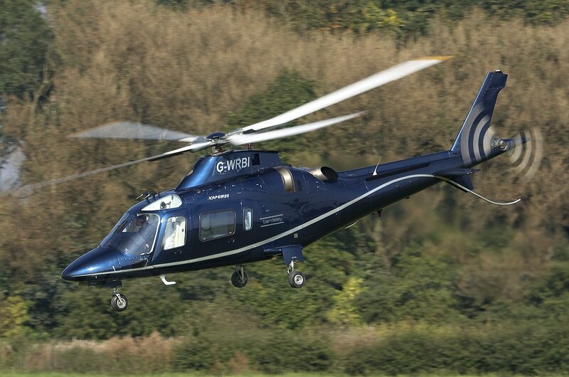 Blue Helicopter in Flight — Dynamic