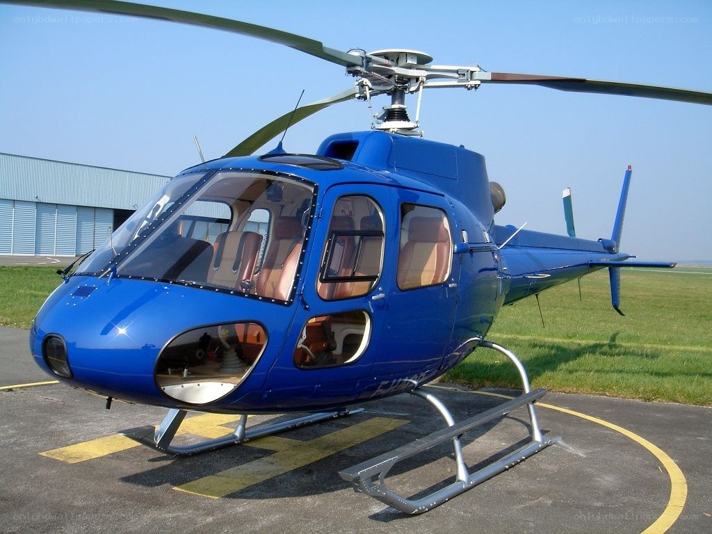 Blue helicopter on helipad