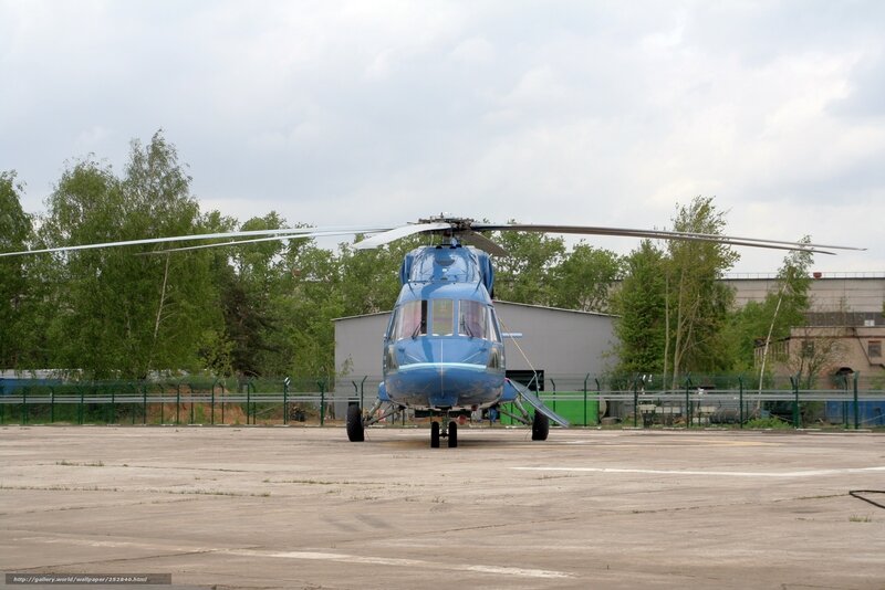 Blue helicopter on tarmac