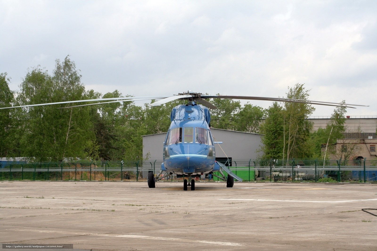 Blue helicopter on tarmac