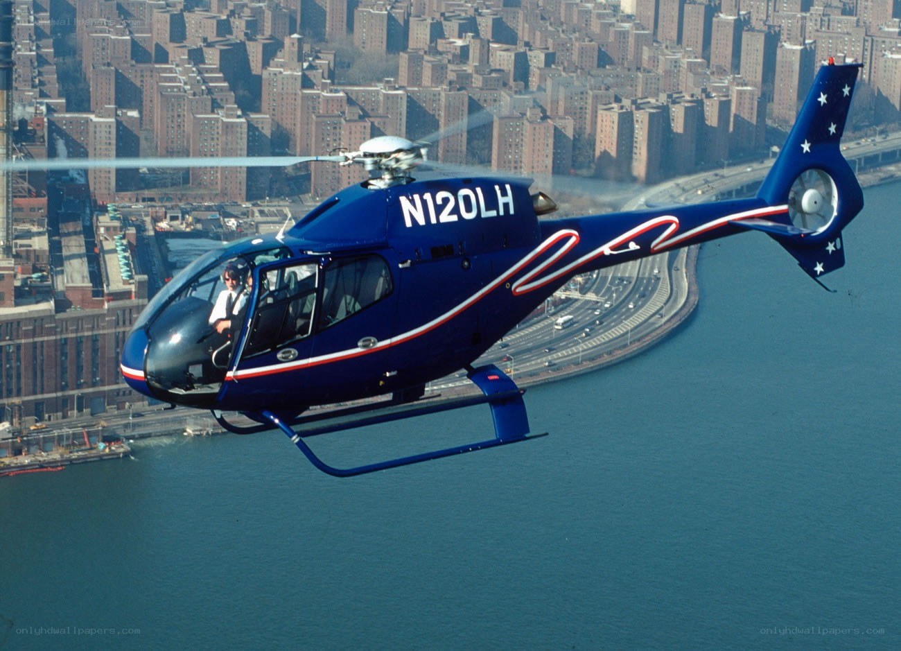Blue helicopter over city