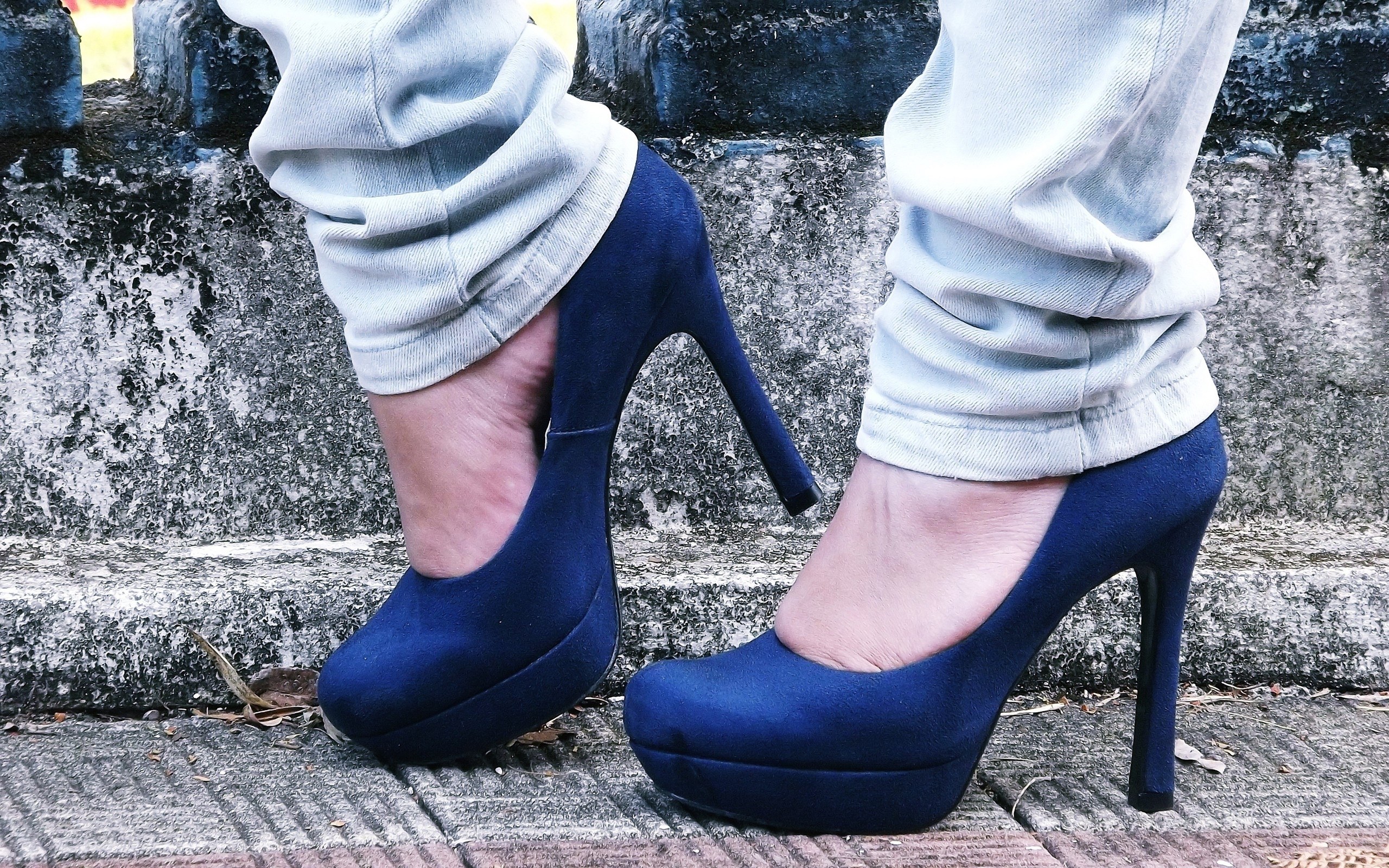 blue high heels on stone steps