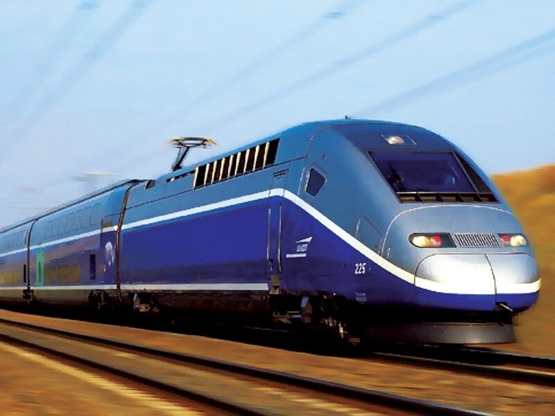 blue high-speed train in motion