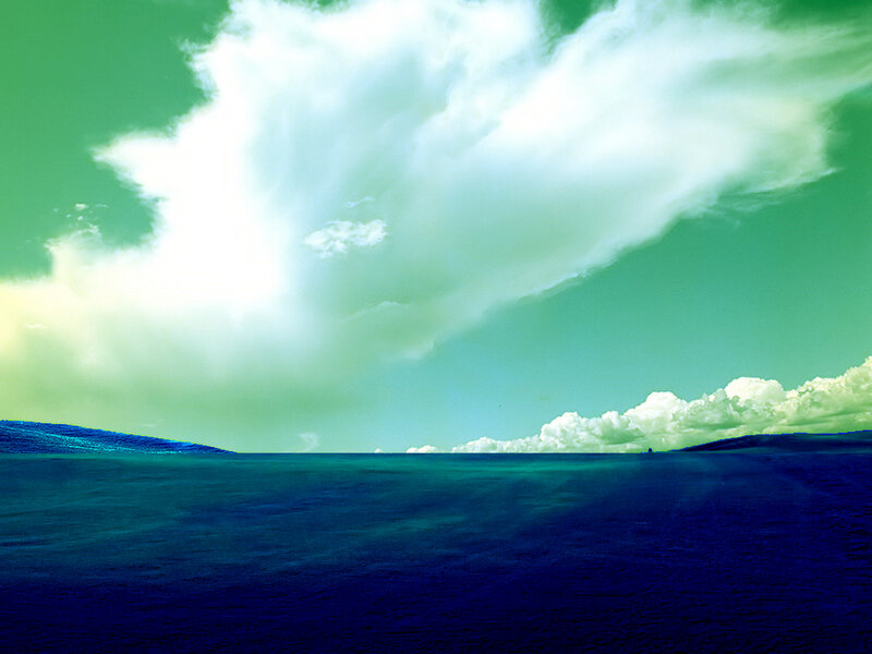 Blue hills under green sky