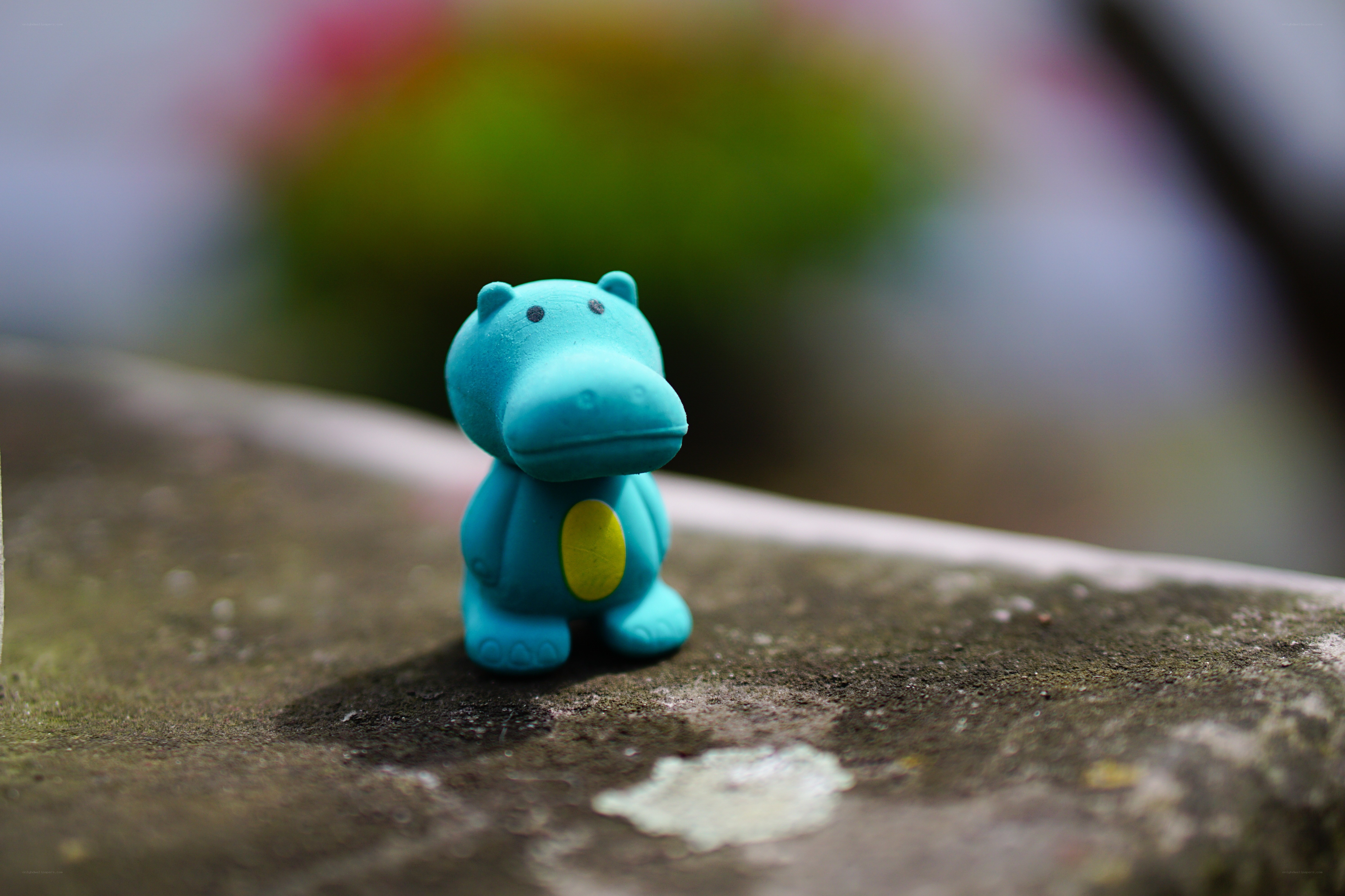 Blue hippo figurine on stone