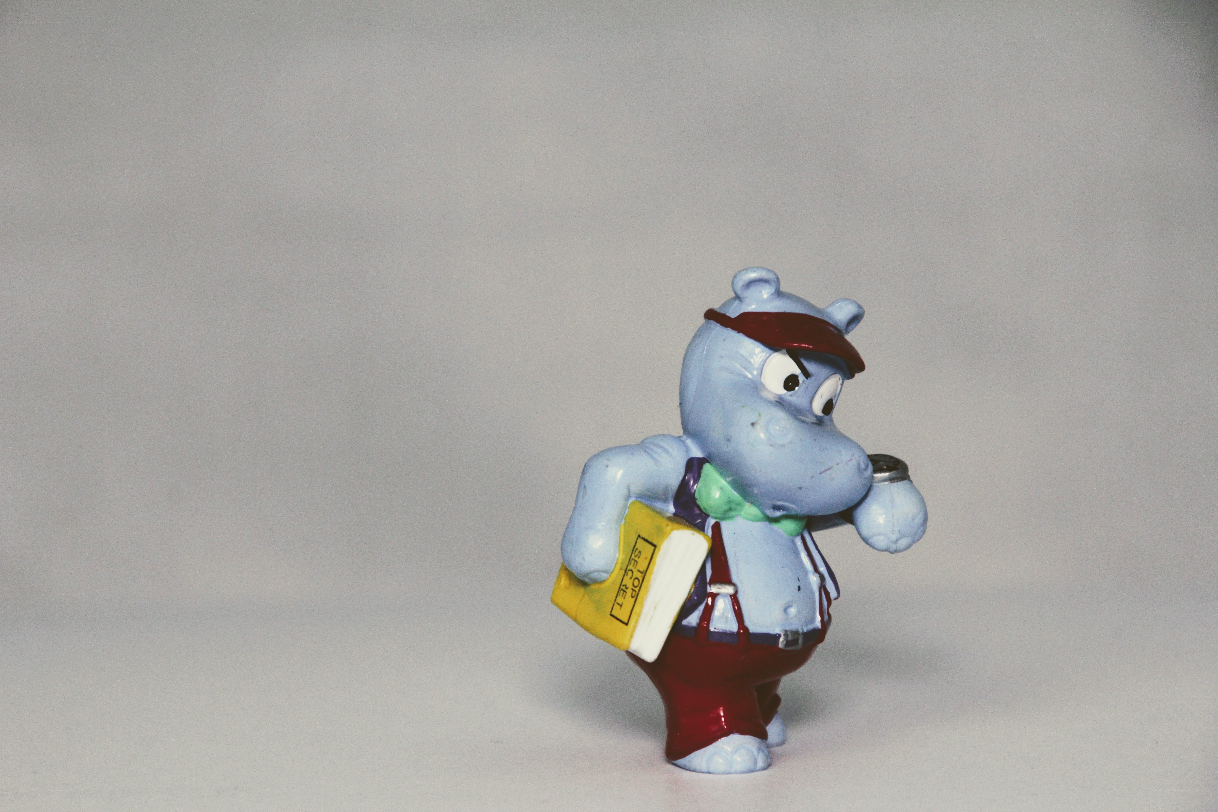 blue hippo figurine with book