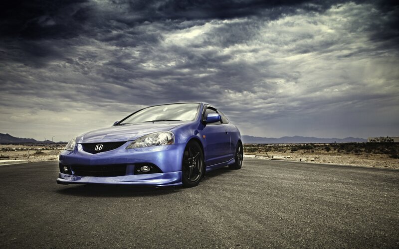 Blue Honda Acura on desert road