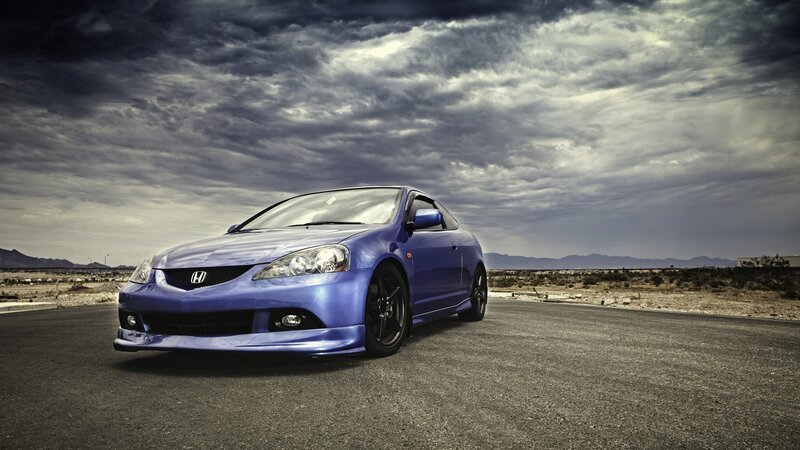 blue honda acura on desert road