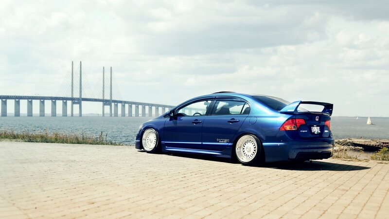 Blue Honda Civic on a pier