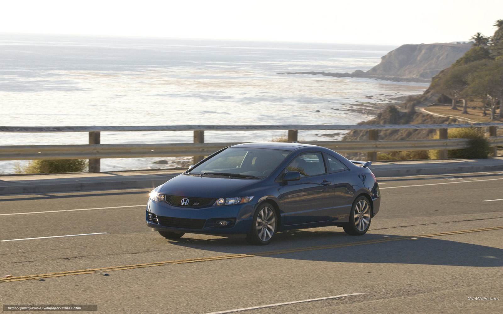 Blue Honda Civic on coastal road