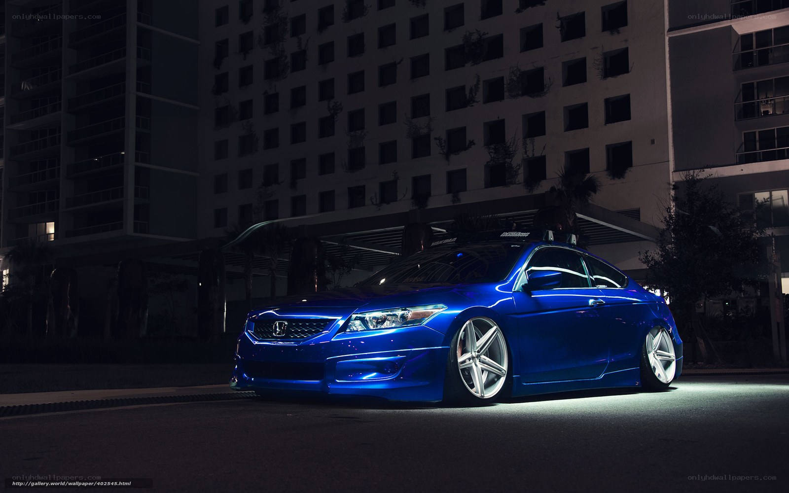 blue honda coupe at night