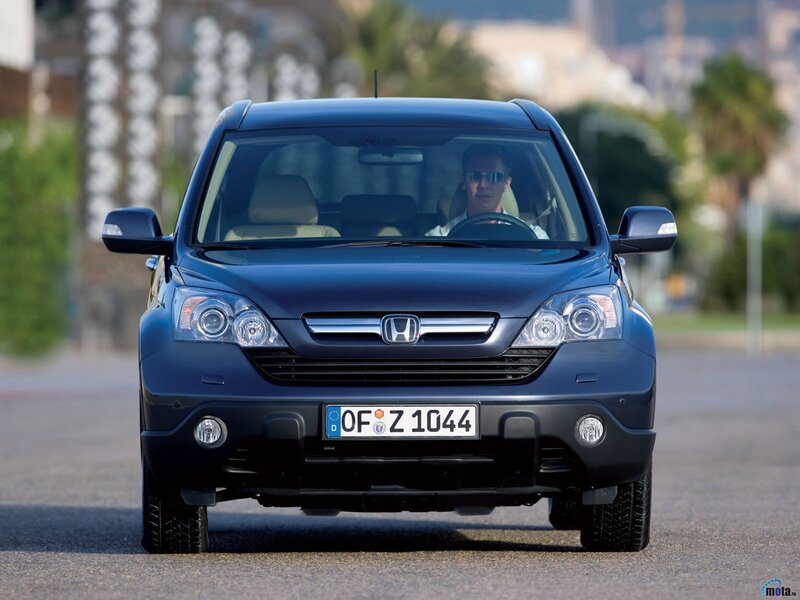 Blue Honda CR-V driving on road