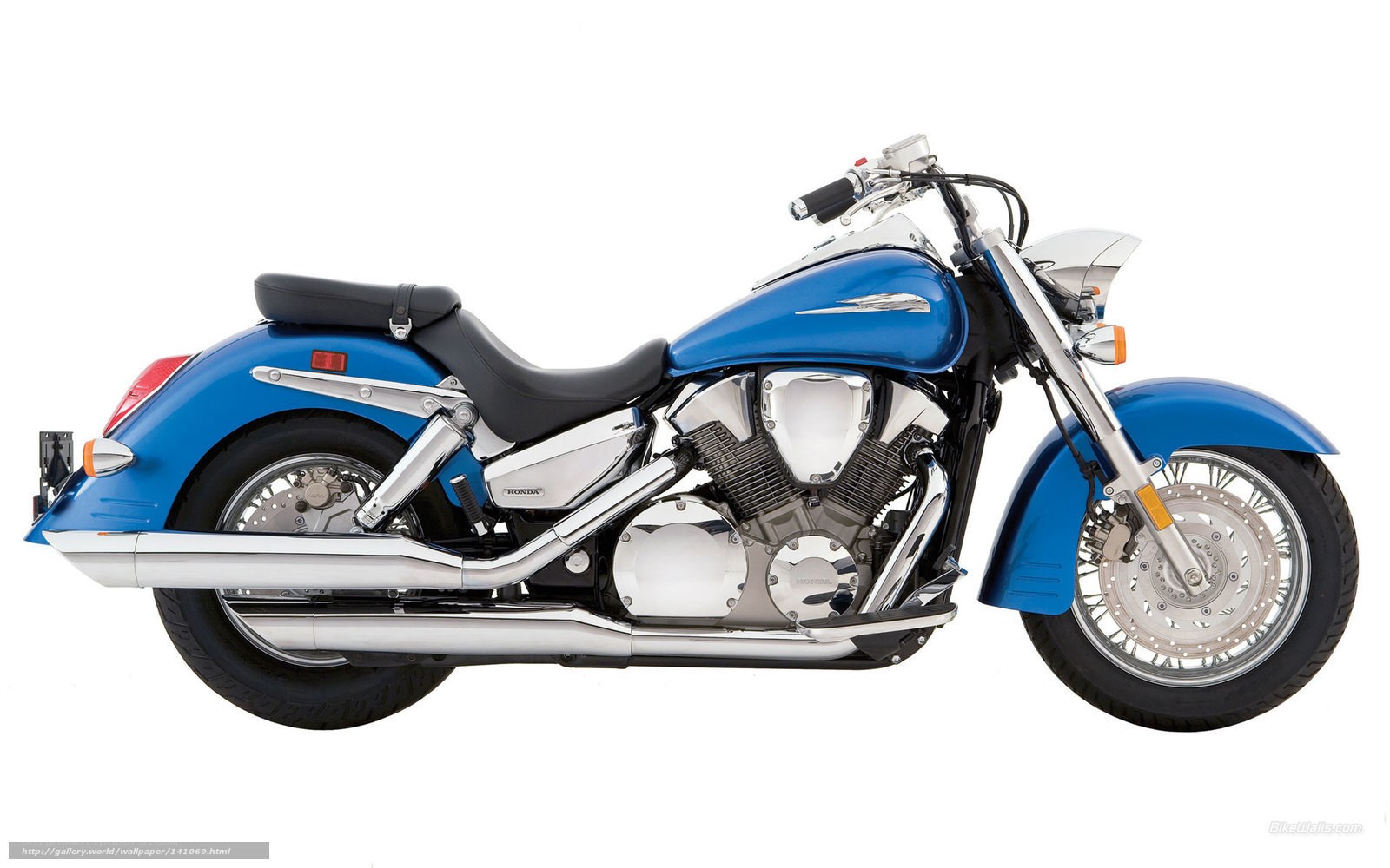 blue Honda cruiser motorcycle