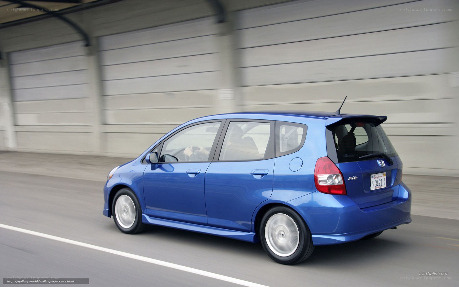 blue honda fit in motion