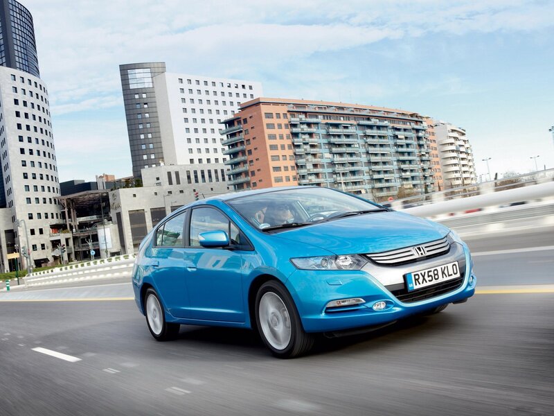 Blue Honda Insight in city