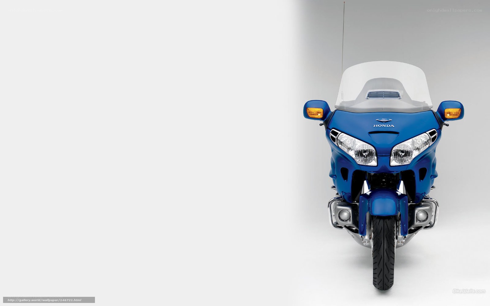 blue honda motorcycle front view