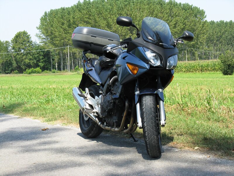 Blue Honda Motorcycle — Green