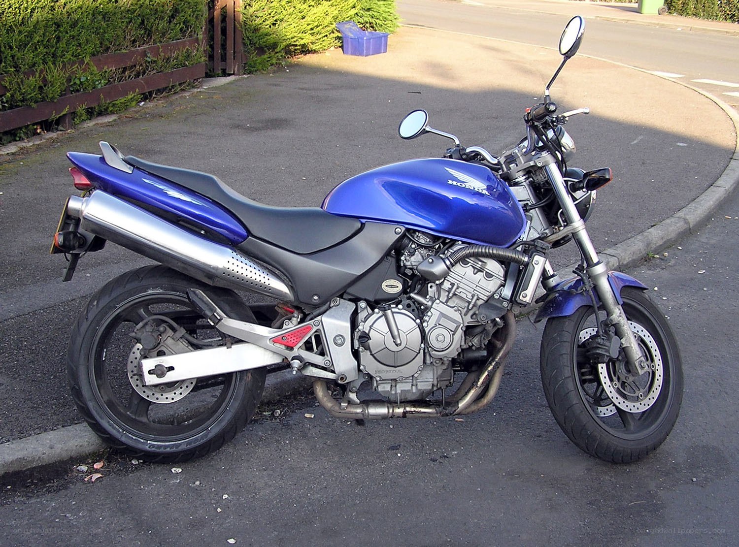 blue honda motorcycle parked