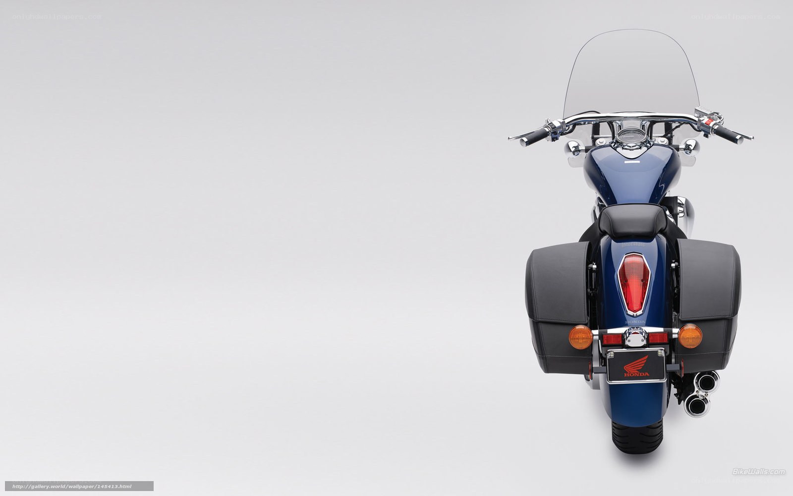 blue honda motorcycle rear view