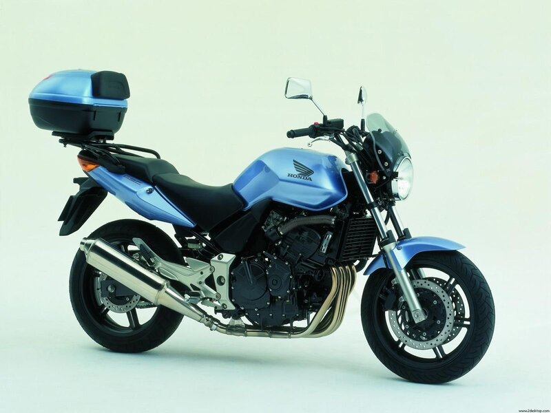 Blue Honda motorcycle with luggage
